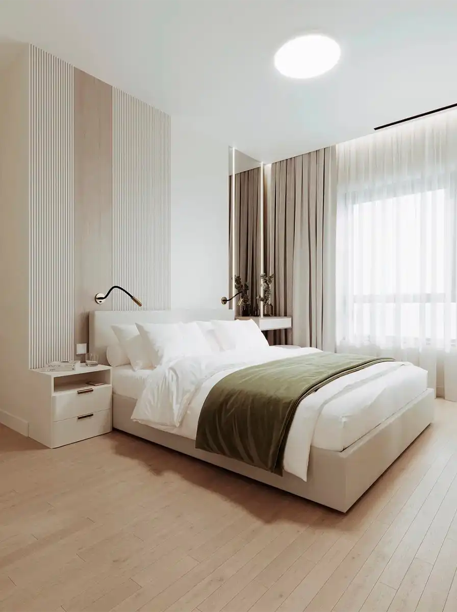 Светлая спальня с деревянными рейками на стене, белой кроватью и оливковым пледом